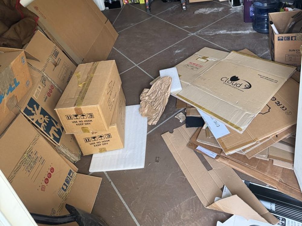 Boxes and shelving cleared from a commercial unit during an office cleanout in Palm Bay, FL