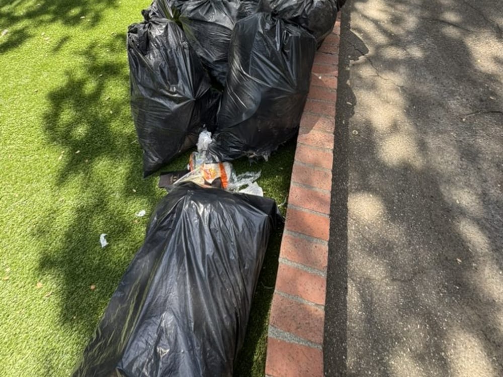 Bagged junk left at the kerb after a rental turnover clearance in Palm Bay, FL