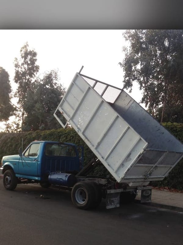 Truck tipping a full load, End of a Palm Bay route