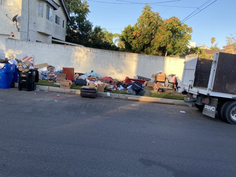 Kerbside bulk collection alongside a condo block in Palm Bay, FL
