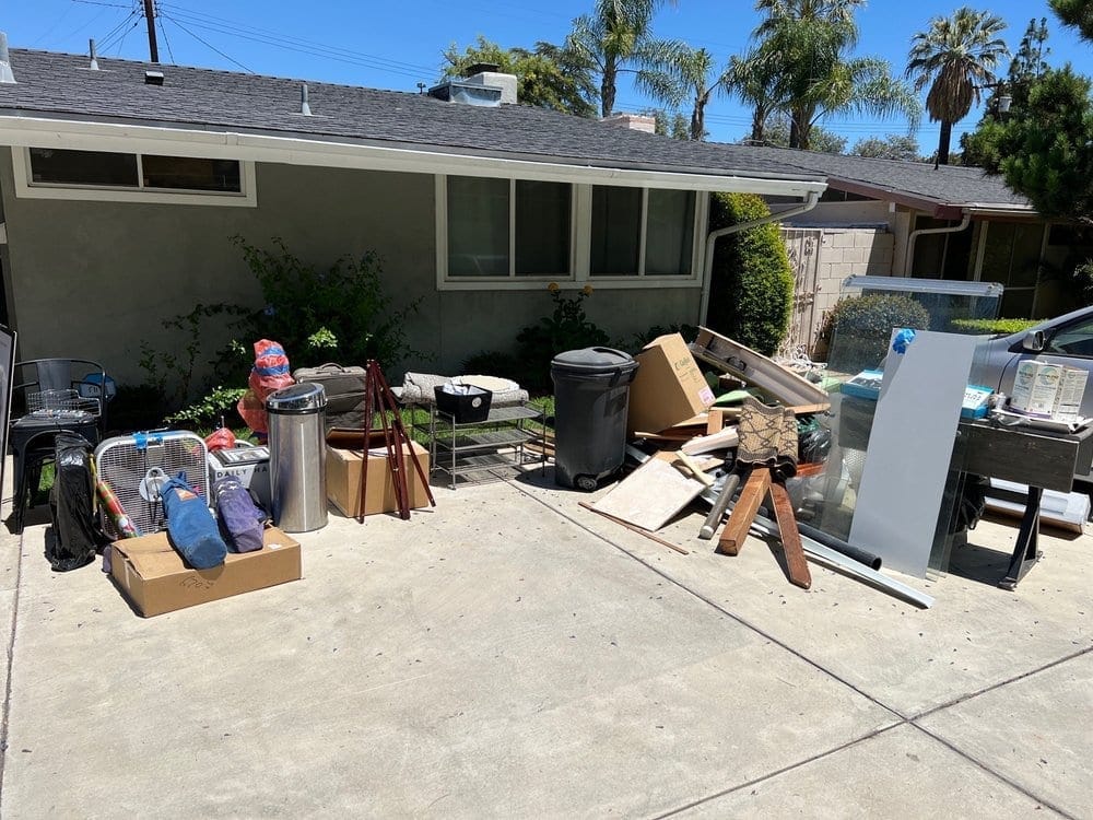 Household junk cleared from the driveway of a single-family home in Palm Bay, FL