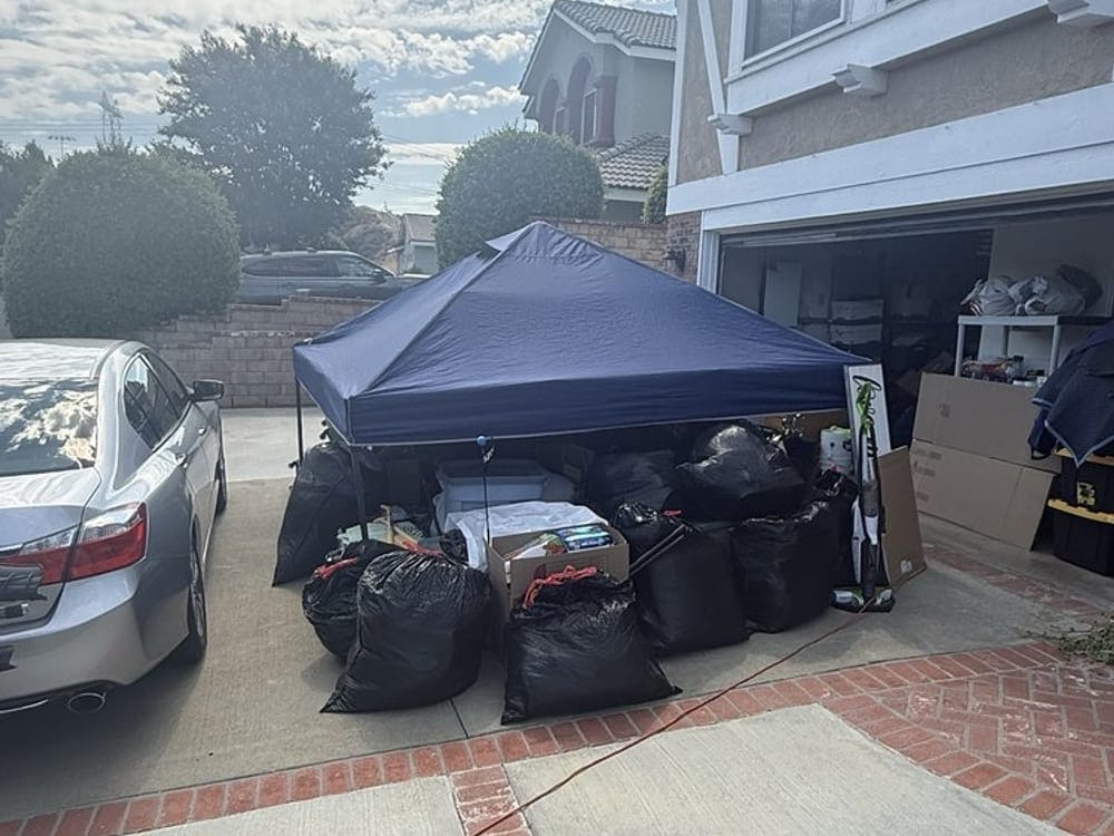 Junk removal job under way on the driveway of a Palm Bay townhome