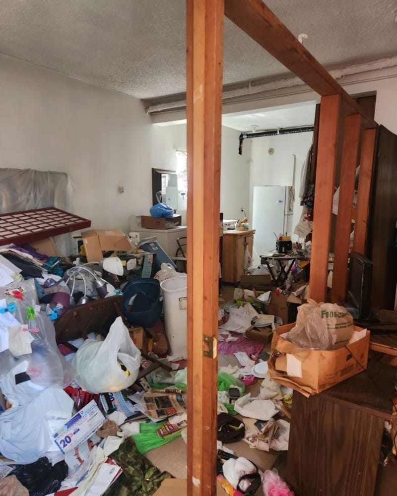 Estate cleanout in progress at a Palm Bay property, sorting items room by room