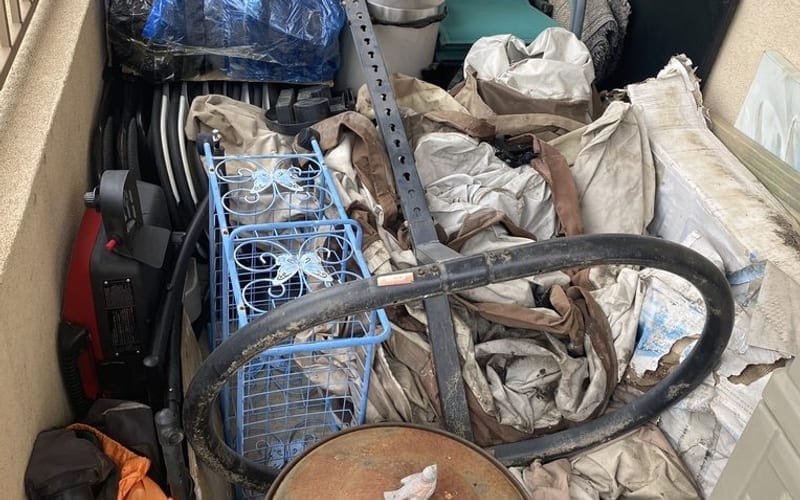 Household appliances and patio junk cleared from a Palm Bay property